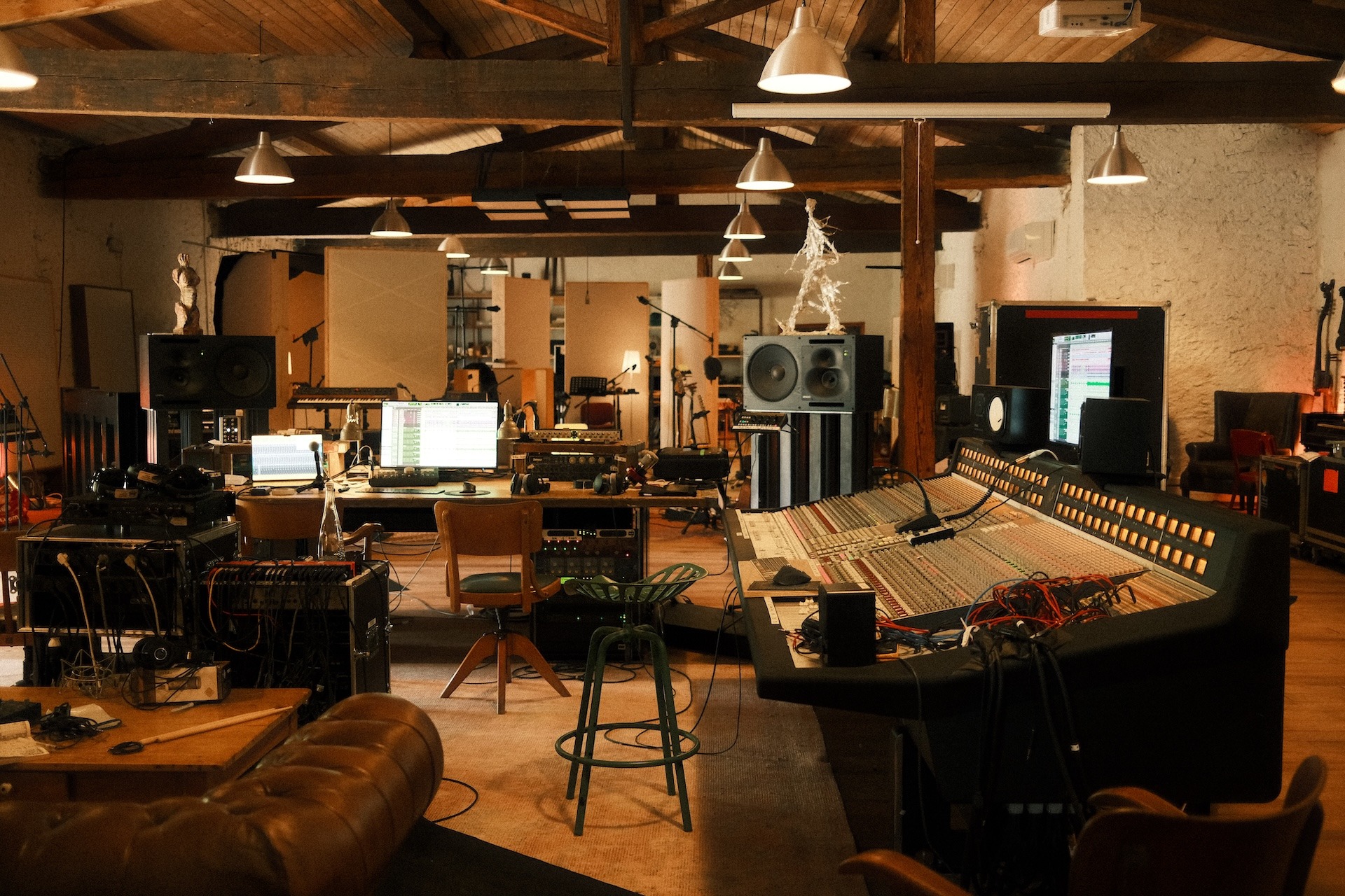 Recording studio control room with mixing console and studio monitors